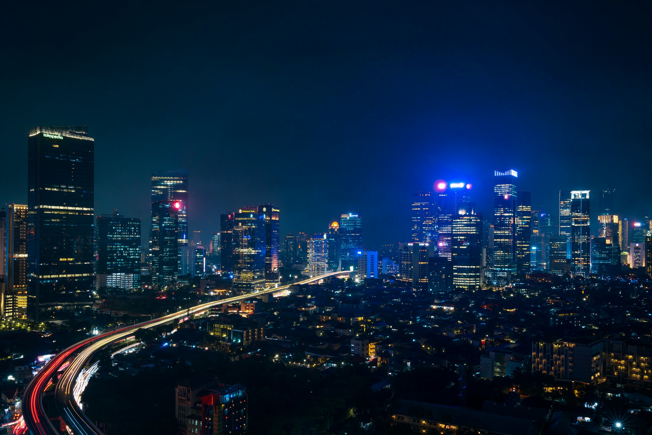 Jakarta’s business district and illuminated transport connections